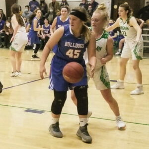 Pretty Prairie 2023 Trinity Kruse looks to pass the ball out against Central Christian.